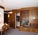 Wohnung 21: Wohnzimmer mit Esstisch und TV
